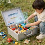 오유데이즈 어린이날 구디백 오픈 박스 사진, 레고 장난감과 다양한 간식이 담겨 있음